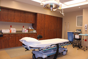 A procedure bed is front and center in the well-stocked minor procedure room at the Plastic Surgery Center of Westchester.