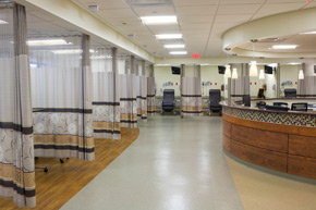 The patient center’s preparation and recovery areas look onto the central nursing station at the surgery center.